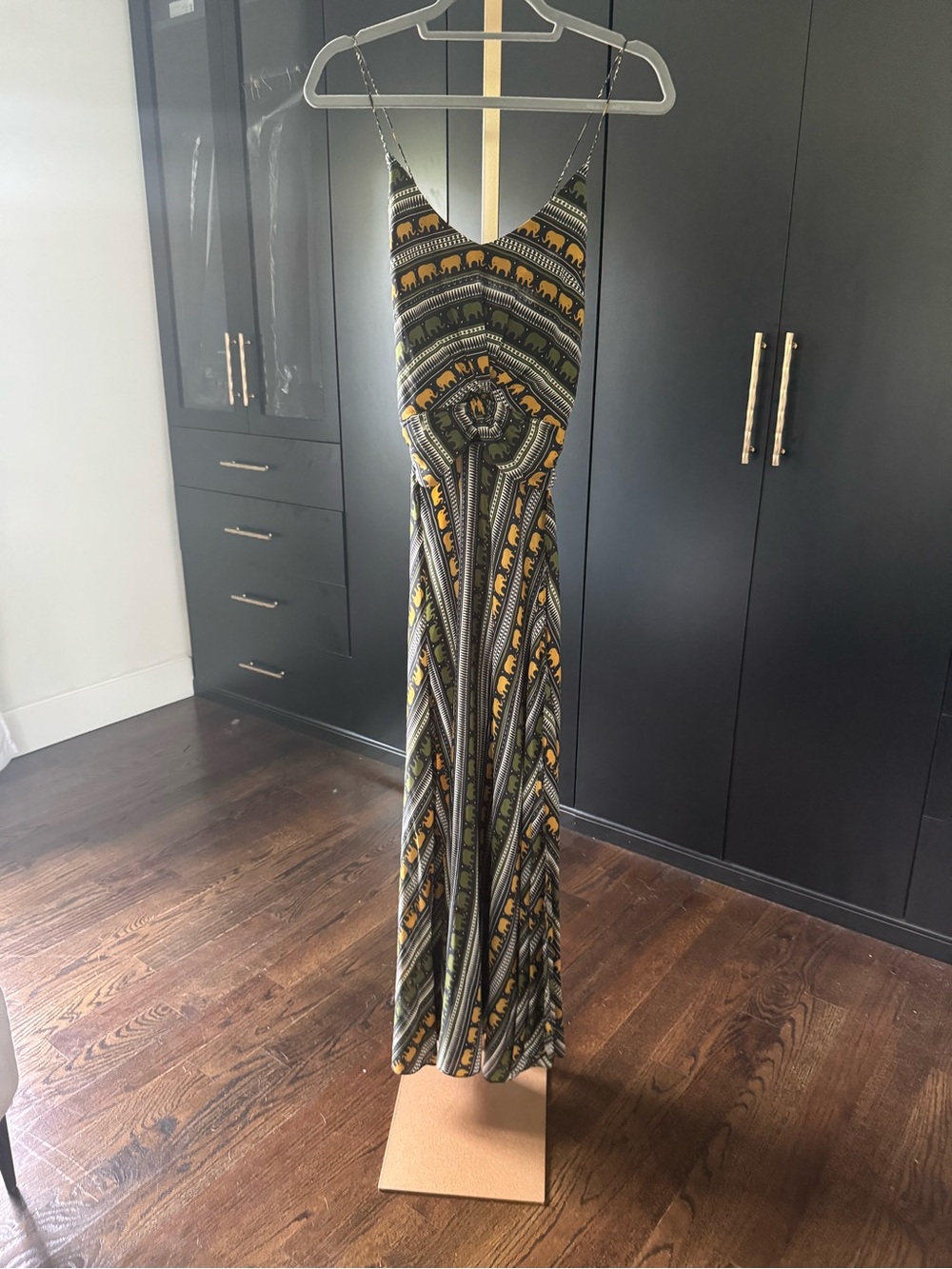 Caroline Constas high-low tank top in olive and yellow elephant pattern